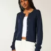 Cardigan con occhielli