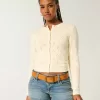 Cardigan con occhielli