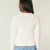 Cardigan con occhielli