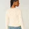 Cardigan con occhielli