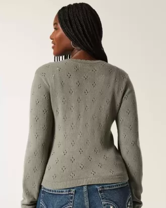 Cardigan con occhielli