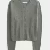 Cardigan con occhielli