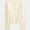 Cardigan con occhielli