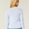 Cardigan con occhielli Cardigan con occhielli