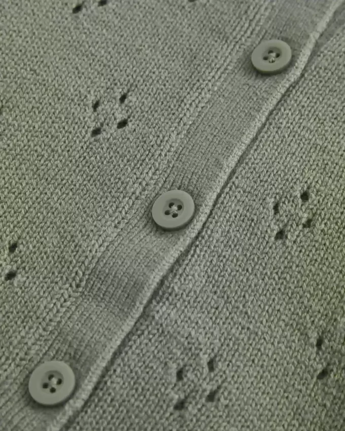 Cardigan con occhielli