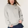 Felpa con cappuccio oversize con grafica da football