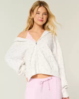 Felpa con cappuccio oversize con motivo floreale e cerniera