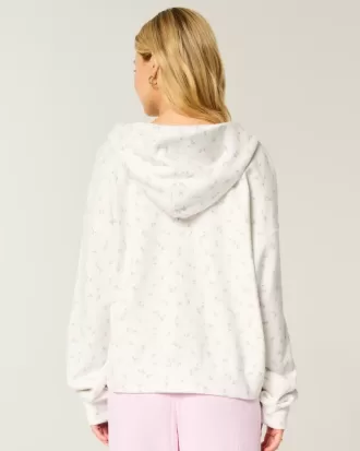 Felpa con cappuccio oversize con motivo floreale e cerniera