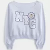 Felpa con stampa NYC e spalle scoperte