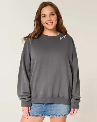 Felpa girocollo oversize con grafica ali d’angelo