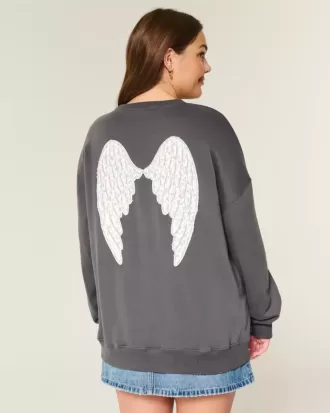 Felpa girocollo oversize con grafica ali d’angelo