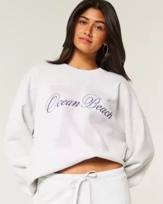 Felpa girocollo oversize con grafica Ocean Beach