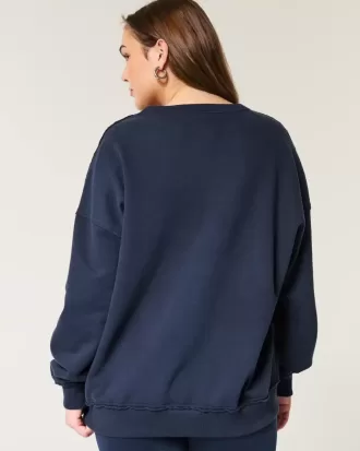 Felpa oversize con scollo a V e grafica UCLA