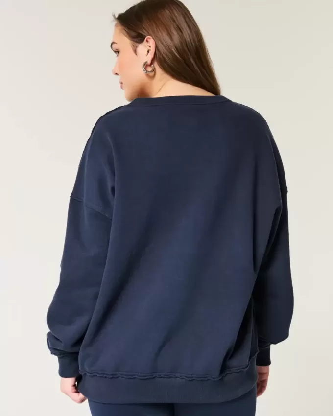 Felpa oversize con scollo a V e grafica UCLA
