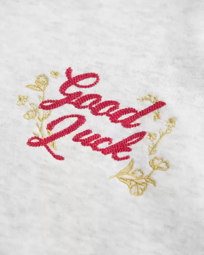Felpa oversize con stampa grafica del capodanno lunare e spalle scoperte