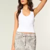 Gonna-pantalone mimetica con lacci rosa a vita bassa