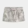 Gonna-pantalone mimetica con lacci rosa a vita bassa