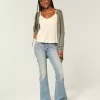 Jeans a zampa a lavaggio medio e vita ultra bassa