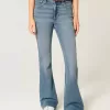Jeans a zampa a vita alta con lavaggio medio