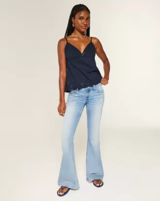 Jeans a zampa con paillettes lavaggio chiaro e vita ultra bassa effetto consumato
