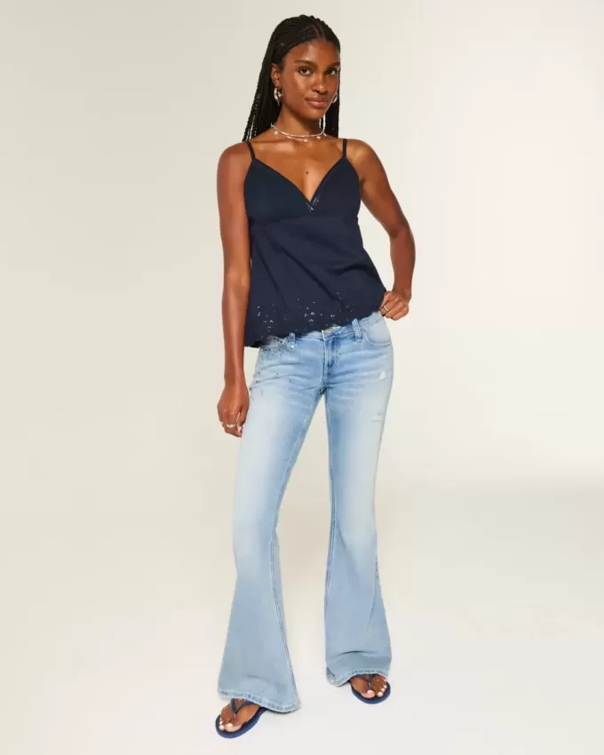 Jeans a zampa con paillettes lavaggio chiaro e vita ultra bassa effetto consumato