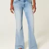 Jeans a zampa con paillettes lavaggio chiaro e vita ultra bassa effetto consumato