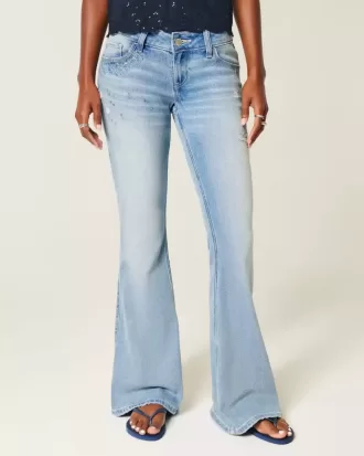 Jeans a zampa con paillettes lavaggio chiaro e vita ultra bassa effetto consumato