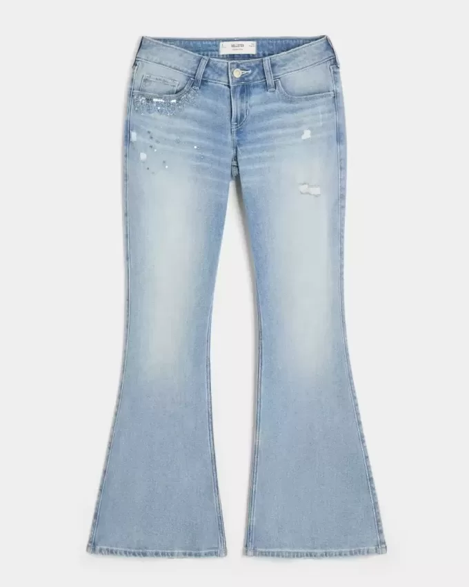 Jeans a zampa con paillettes lavaggio chiaro e vita ultra bassa effetto consumato