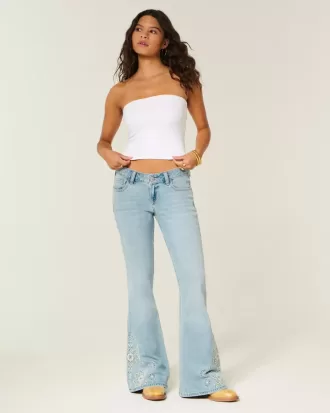 Jeans a zampa con ricamo floreale e lavaggio chiaro a vita bassissima