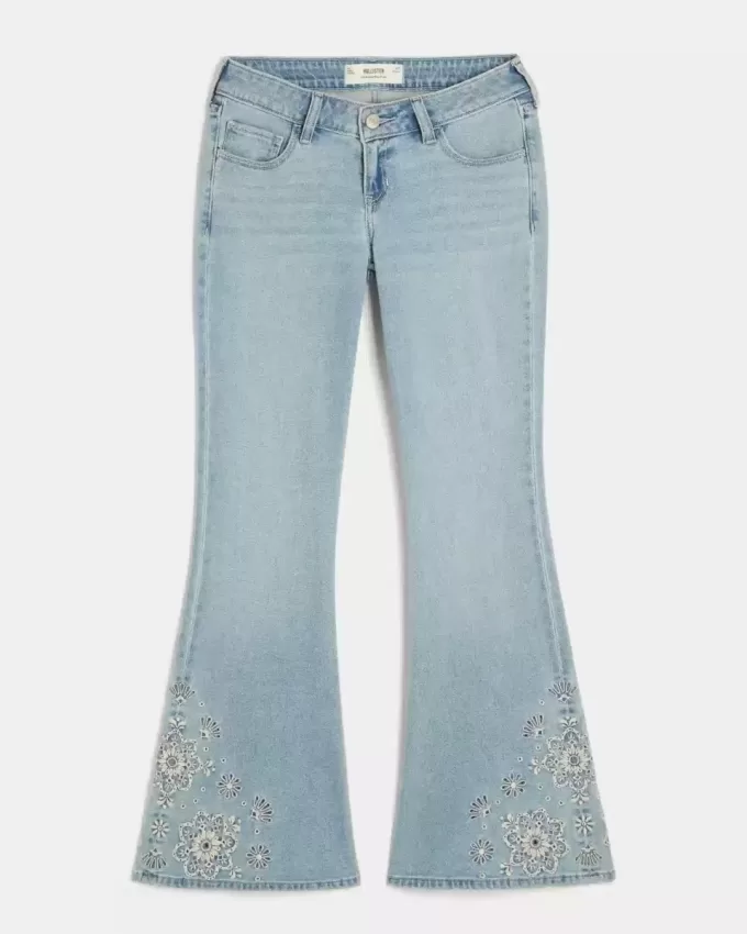 Jeans a zampa con ricamo floreale e lavaggio chiaro a vita bassissima