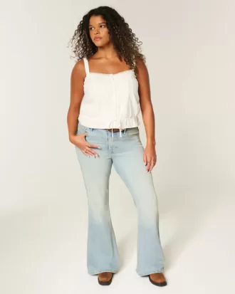 Jeans a zampa con tasche a stella e lavaggio chiaro a vita alta