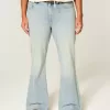 Jeans a zampa con tasche a stella e lavaggio chiaro a vita alta