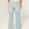 Jeans a zampa con tasche a stella e lavaggio chiaro a vita alta
