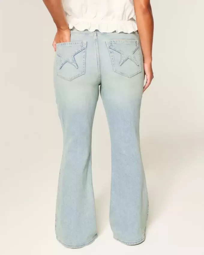 Jeans a zampa con tasche a stella e lavaggio chiaro a vita alta