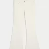 Jeans a zampa con tasche ricamate bianche a vita bassissima