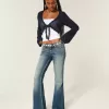 Jeans a zampa ricamati a lavaggio medio e vita bassissima