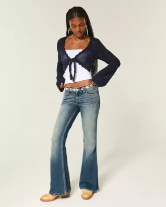 Jeans a zampa ricamati a lavaggio medio e vita bassissima