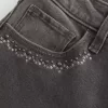 Jeans a zampa ricamati neri lavati a vita alta