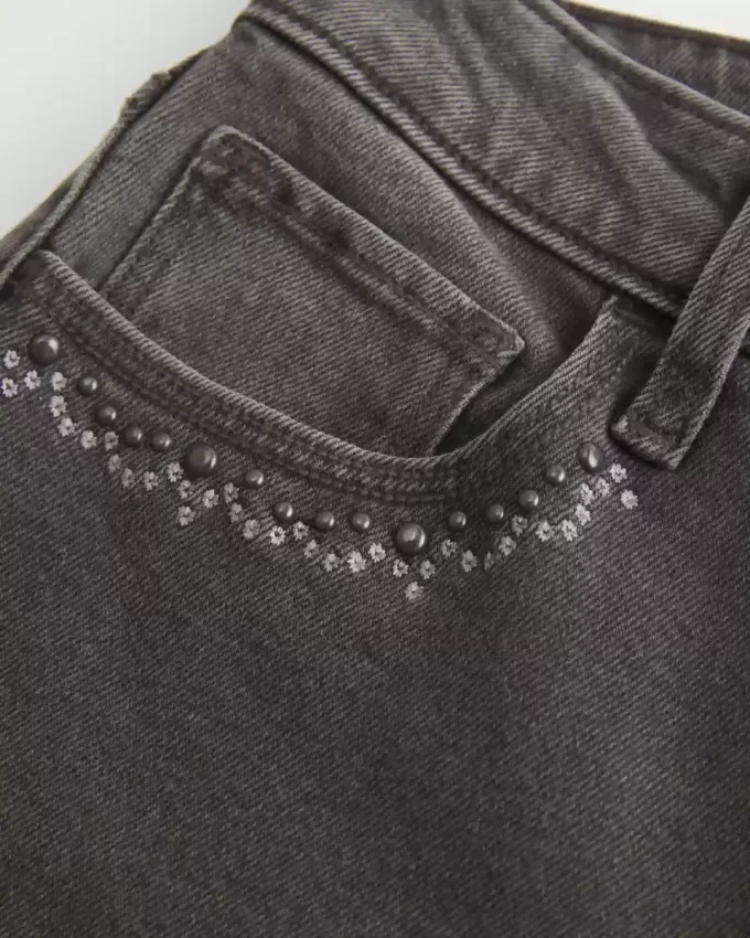 Jeans a zampa ricamati neri lavati a vita alta