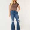 Jeans a zampa strappati a vita alta con lavaggio medio