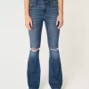 Jeans a zampa strappati a vita alta con lavaggio medio