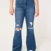 Jeans a zampa strappati a vita alta con lavaggio medio