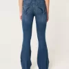 Jeans a zampa strappati a vita alta con lavaggio medio
