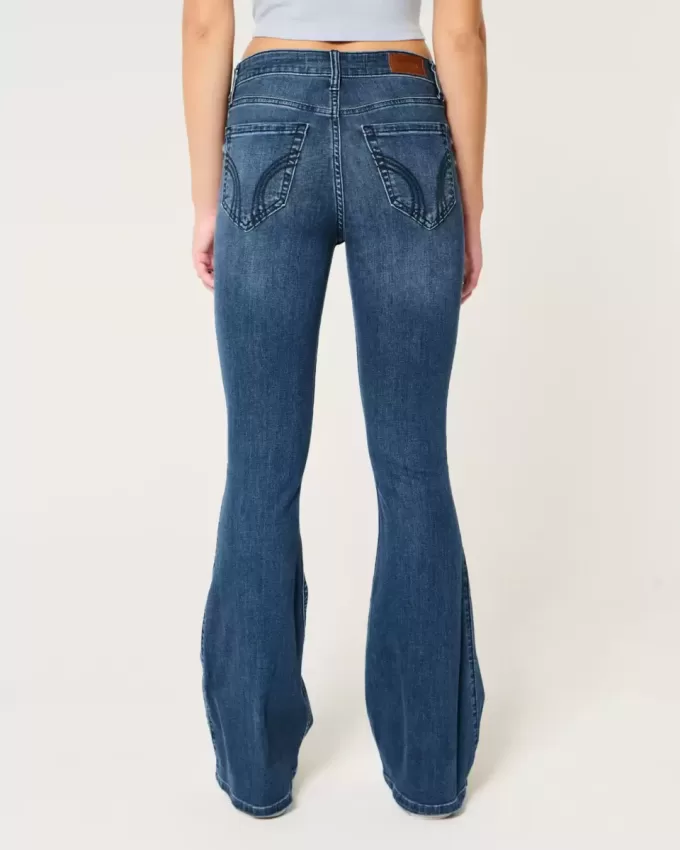 Jeans a zampa strappati a vita alta con lavaggio medio