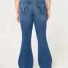 Jeans a zampa strappati a vita alta con lavaggio medio