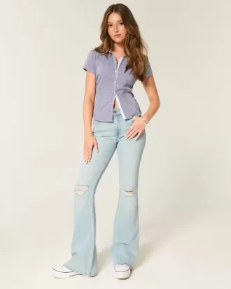 Jeans a zampa strappati a vita alta e lavaggio chiaro
