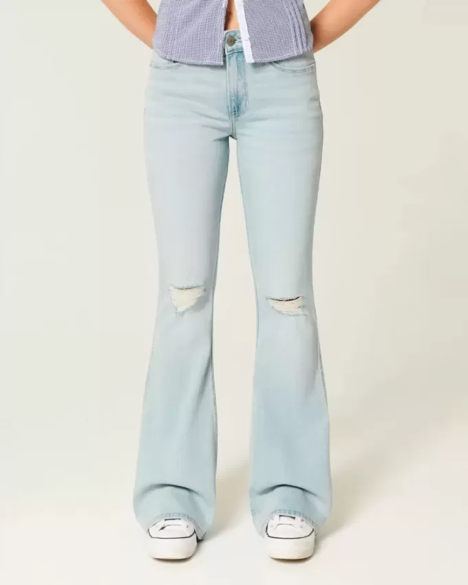 Jeans a zampa strappati a vita alta e lavaggio chiaro