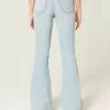 Jeans a zampa strappati a vita alta e lavaggio chiaro
