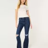 Jeans a zampa strappati a vita alta e lavaggio scuro
