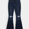 Jeans a zampa strappati a vita alta e lavaggio scuro